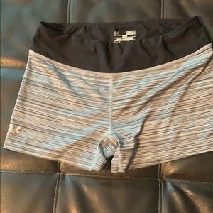 Gray and black fitted under armor shorts